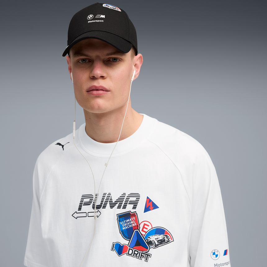 Black baseball cap with PUMA lettering worn by male model.
