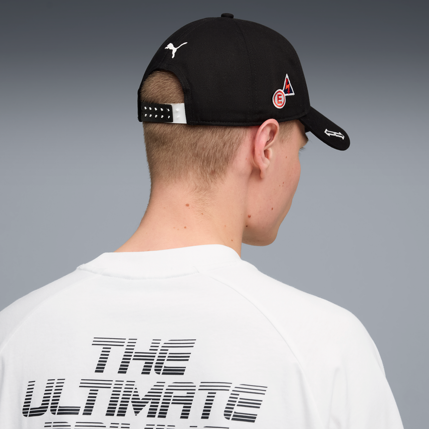 Black baseball cap viewed from the back with PUMA logo.