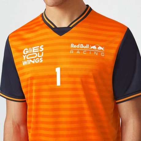 Orange T-shirt detail with GIVES YOU WINGS print.