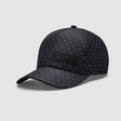 Black cap with polka dot pattern and Mercedes logo on front