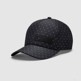 Black cap with polka dot pattern and Mercedes logo on front
