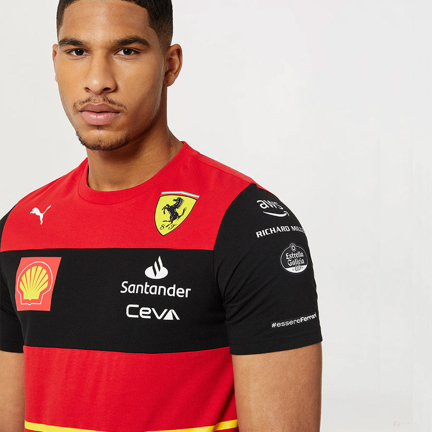 Male model in red polo with Ferrari shield and multiple sponsor logos