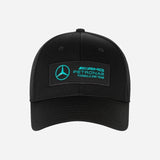 Black cap with Mercedes-Benz Petronas Formula One Team logo on a white background