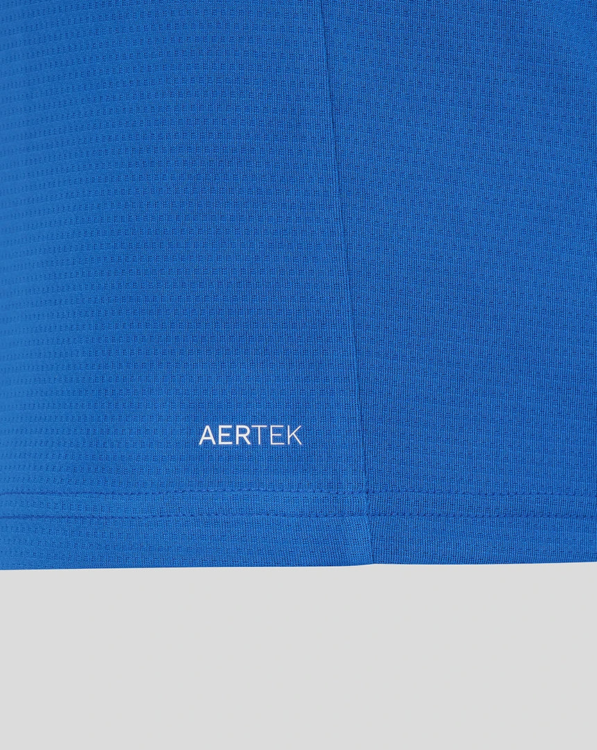 Blue women's polo shirt with AERTEK print on the lower part.