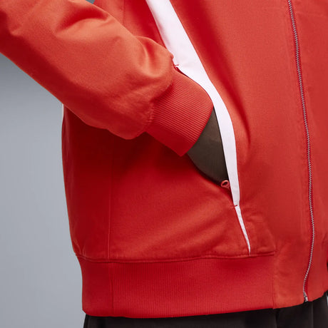 Red Ferrari jacket pocket close-up.