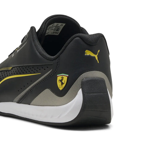 Black PUMA shoe with Ferrari logo and yellow accents from rear