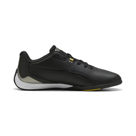 Black PUMA shoe with yellow details side view