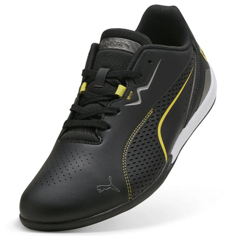 Black PUMA shoe front view with yellow lines