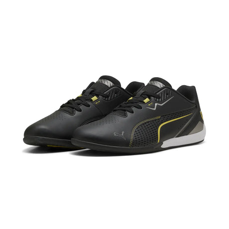 Black PUMA shoe with yellow details side view