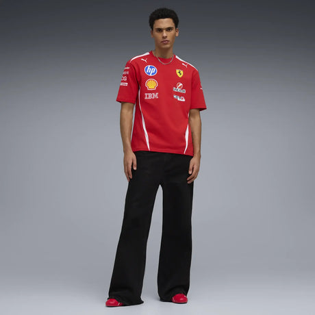Ferrari T-shirt worn by model with black pants and PUMA logo.