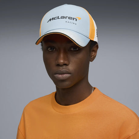 Person wearing blue McLaren cap