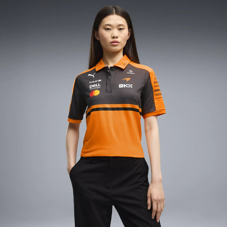 Woman wearing black pants and orange-black design T-shirt
