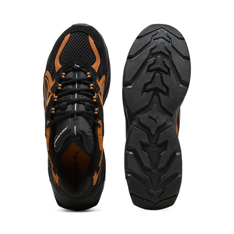PUMA shoe sole view in black and orange colors