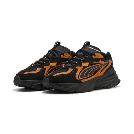 PUMA shoe in black with orange accents
