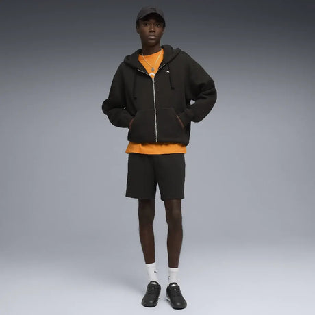 Black hoodie with black shorts and yellow T-shirt.