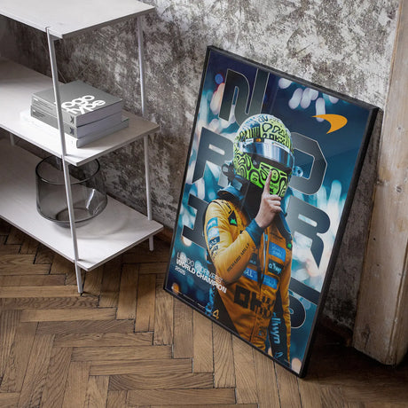 Framed Lando Norris poster in furnished room.