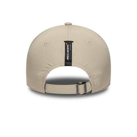 Back view of beige cap with McLaren text and adjustable buckle.
