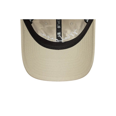 Inside view of beige cap with New Era logo.