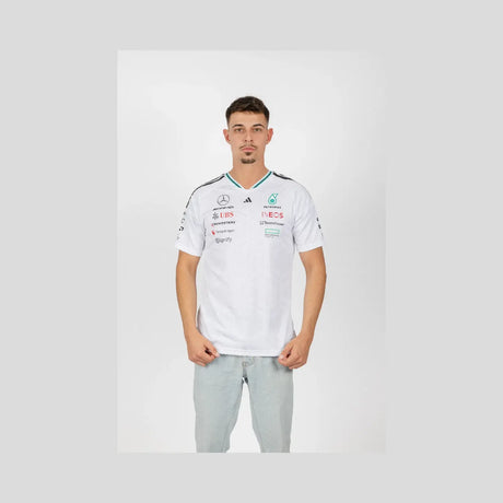 Young man wearing white Mercedes crew neck t-shirt