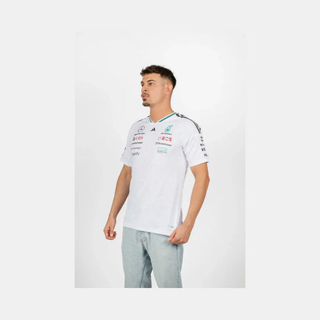 Young man side view in white Mercedes crew neck t-shirt