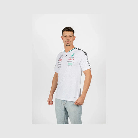Young man side view wearing white Mercedes crew neck t-shirt