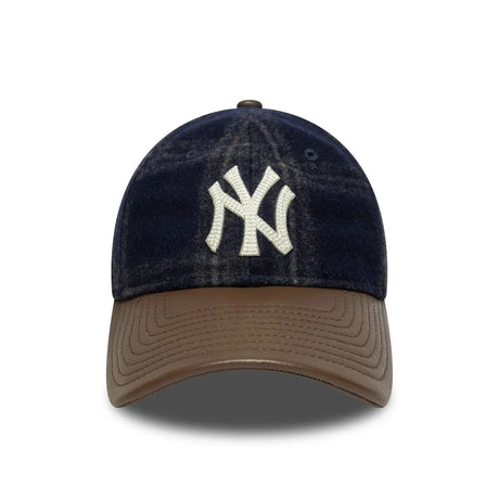 Front view of New York Yankees cap with brown leather strap.