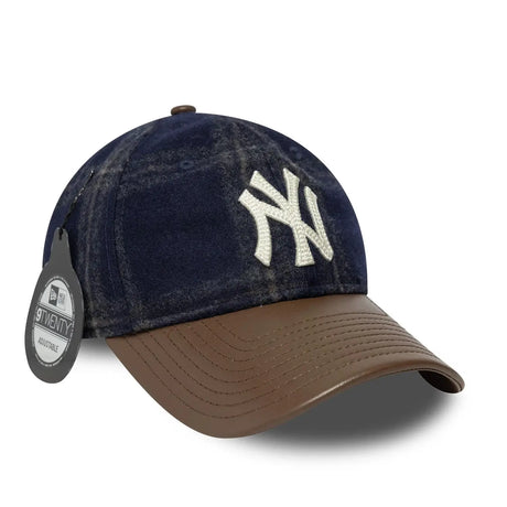 New York Yankees cap with brown leather strap and label.
