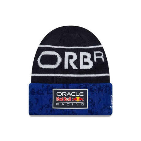 Blue knitted cap with logo and patterned sections