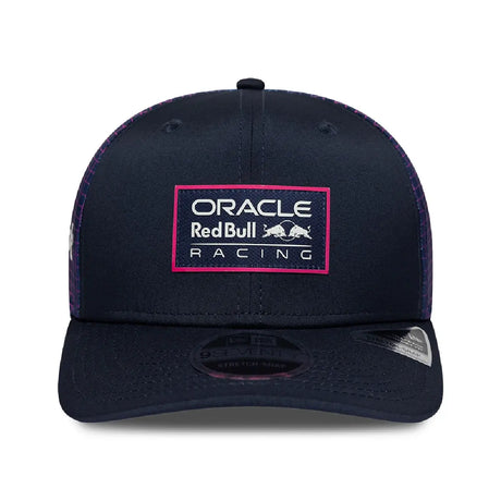 Blue cap with ORACLE logo, front view.
