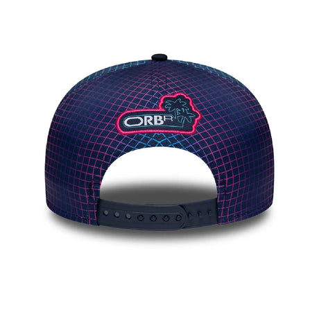 Blue cap rear view with palm pattern.
