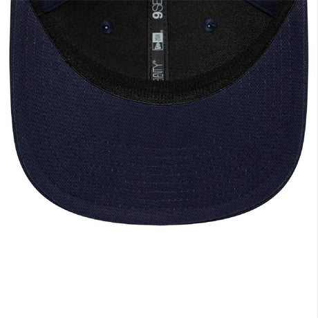 Inside view of blue cap with dark interior.