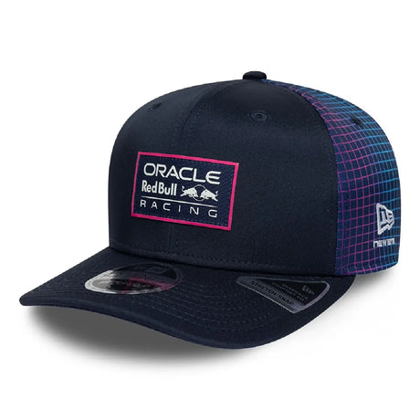 Blue Red Bull cap with ORACLE logo and Racing emblem.