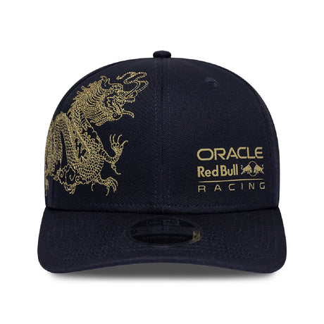 Blue baseball cap front view with gold design, NEW ERA®.