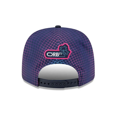 Red Bull cap rear with blue grid pattern.