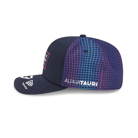 Red Bull cap side view with blue grid pattern.