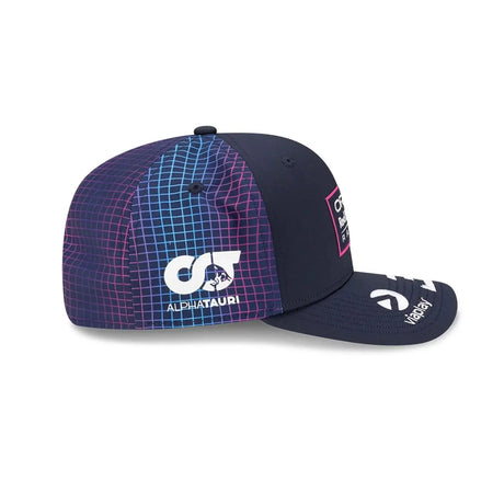 Red Bull cap side view with blue grid pattern.